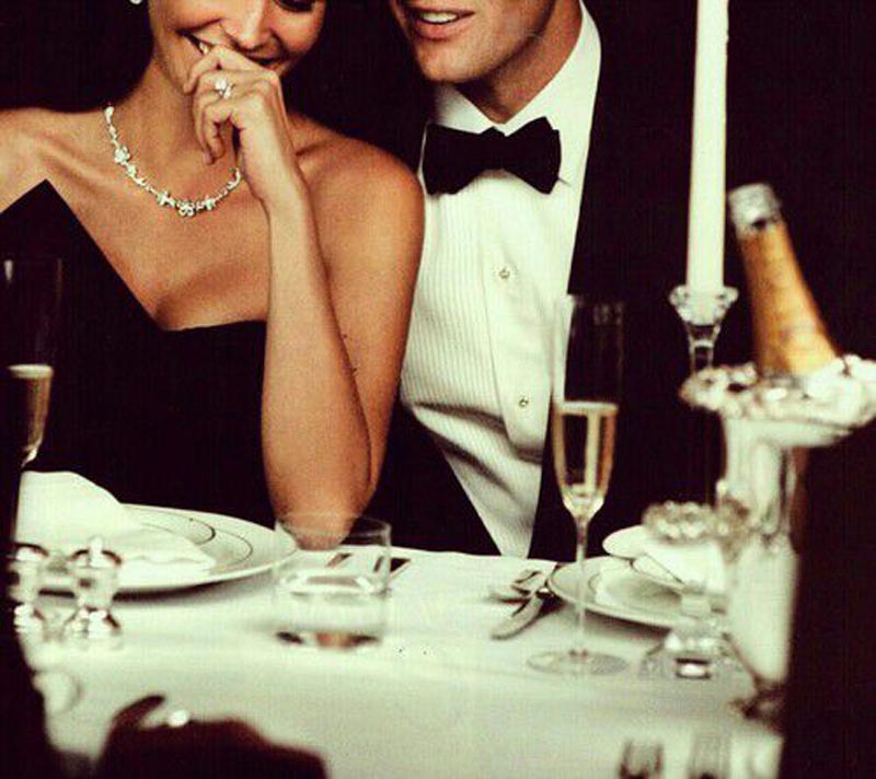 couple in formal wear at dinner party